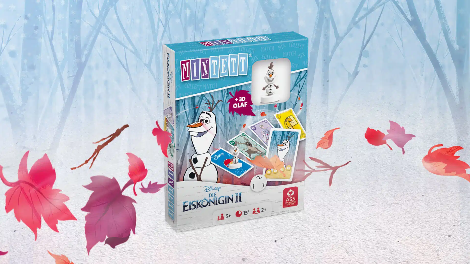 Das Disney Die Eiskoenigin 2 Mixtett Olaf Spiel steht auf einem verschneitem Untergrund. Im Hintergrund ist ein verschneiter Wald zu erkennen, um das Spiel herum fliegen ein paar bunte Laubblätter im Wind.